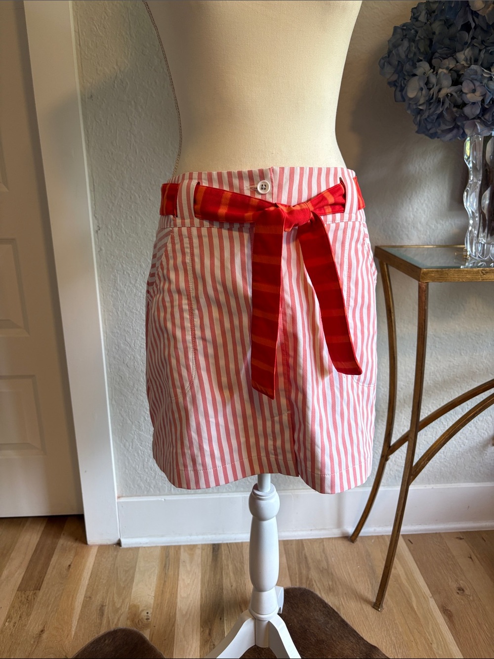 Nike Golf Red & Orange Striped Tie-Waist Shorts with Skirt overlay.